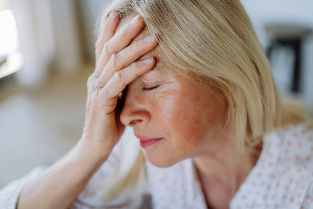 Current woman with dizziness, hand on head, health problems, healthcare, medical complain.